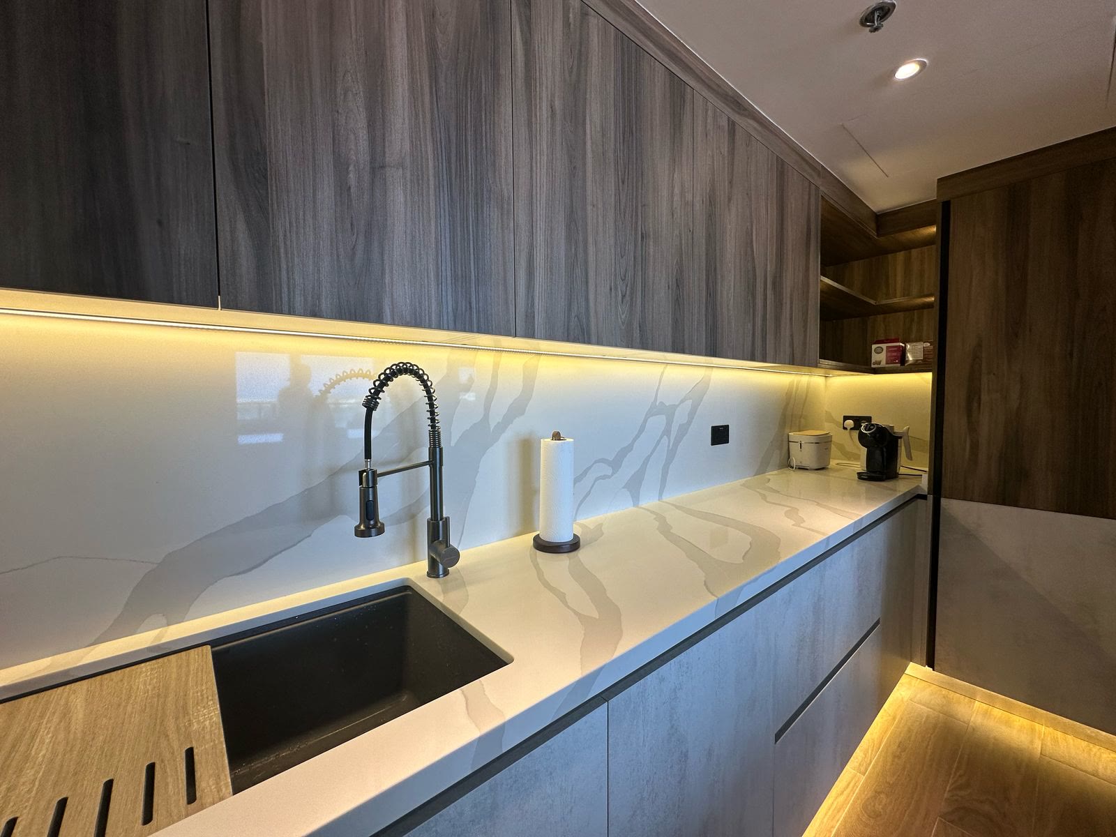 Completed timber kitchen cabinetry and illuminated worktop