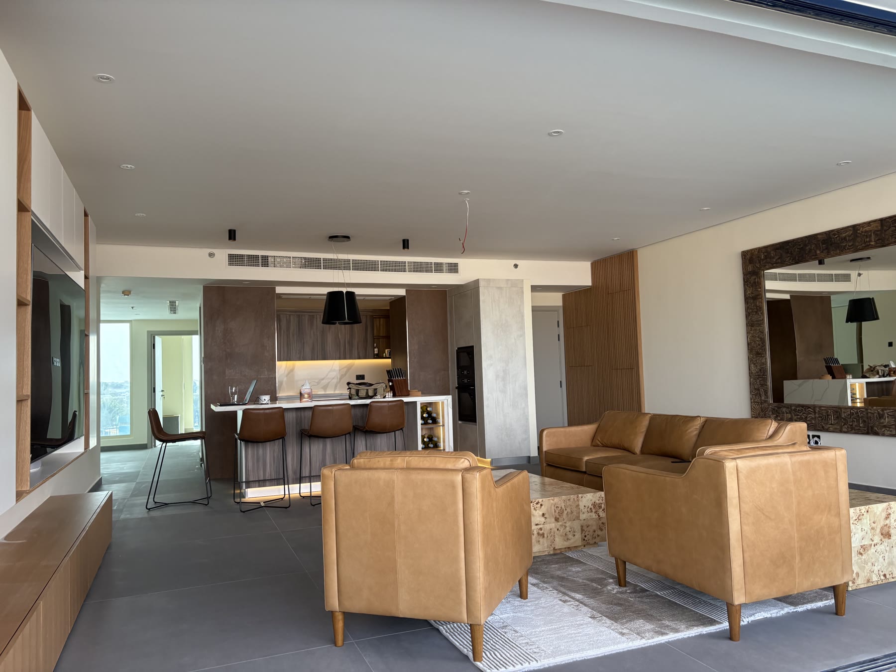 Completed open-plan kitchen and furnished living area
