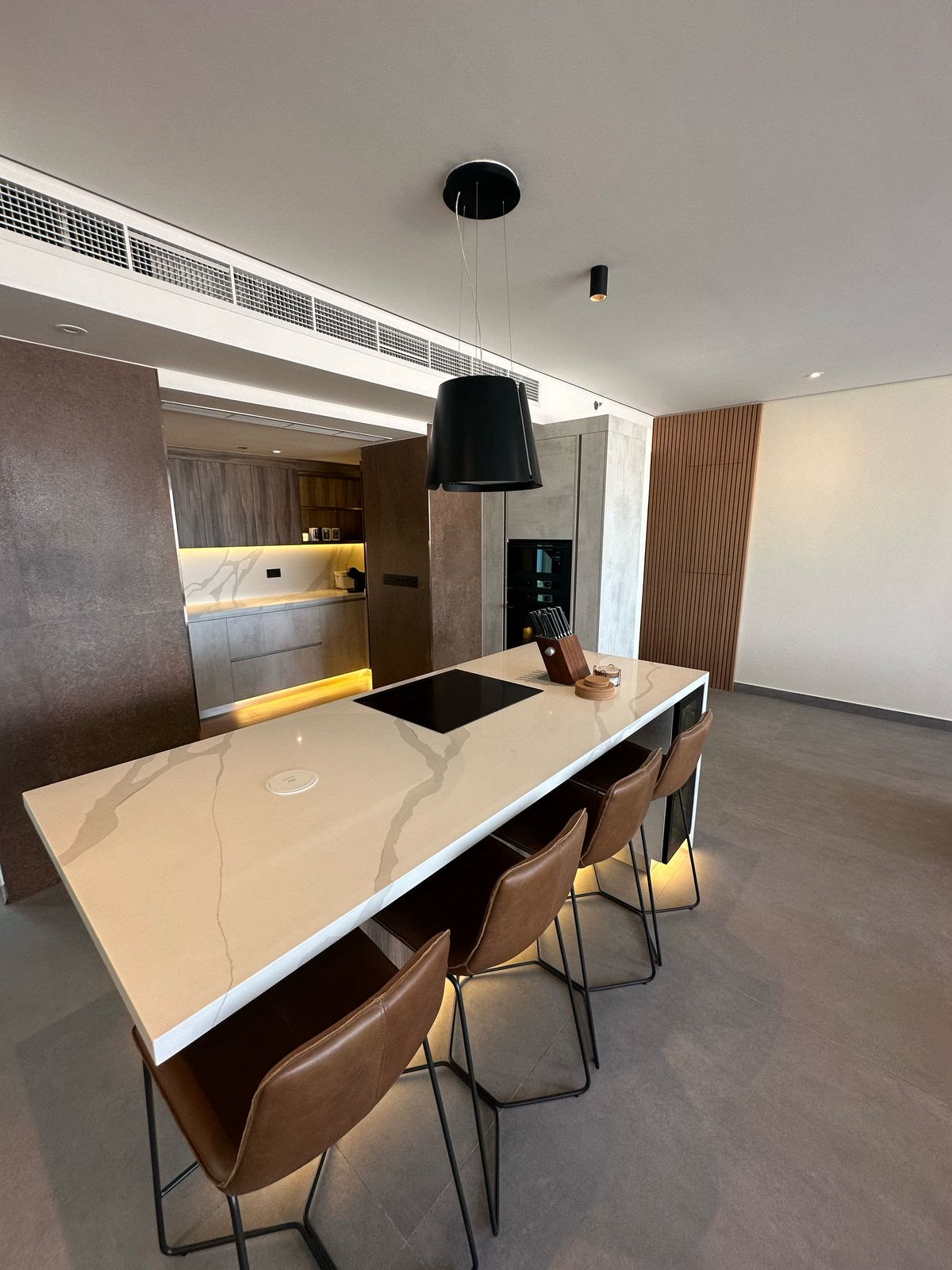 Completed kitchen island with dining stools
