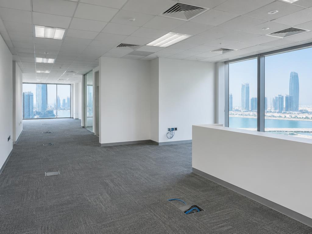 Empty developer-grade corporate office before fit-out on Al Maryah Island, Abu Dhabi