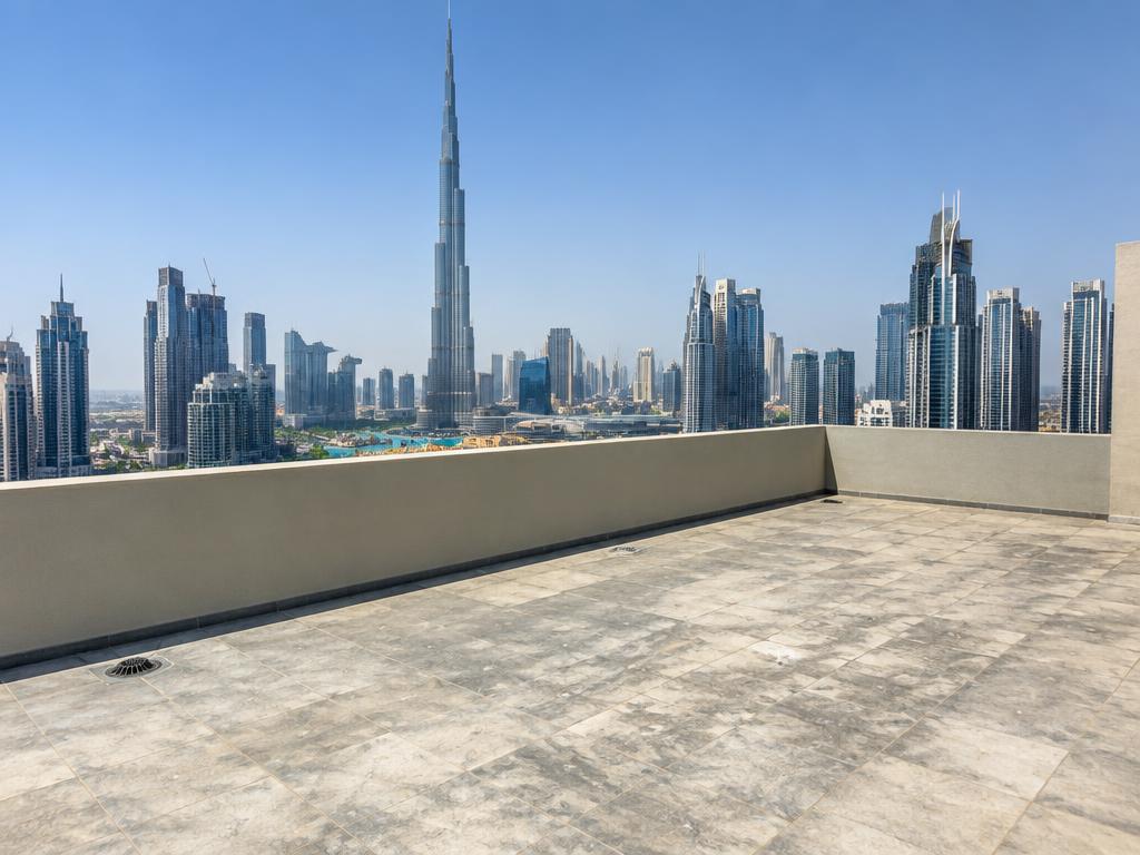 Empty concrete penthouse roof terrace before landscaping in Downtown Dubai