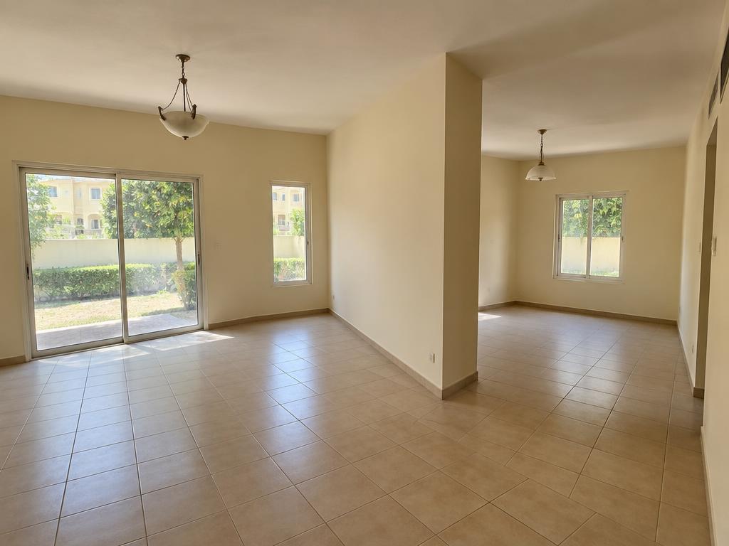 Divided townhouse living and dining rooms before renovation in The Springs, Dubai